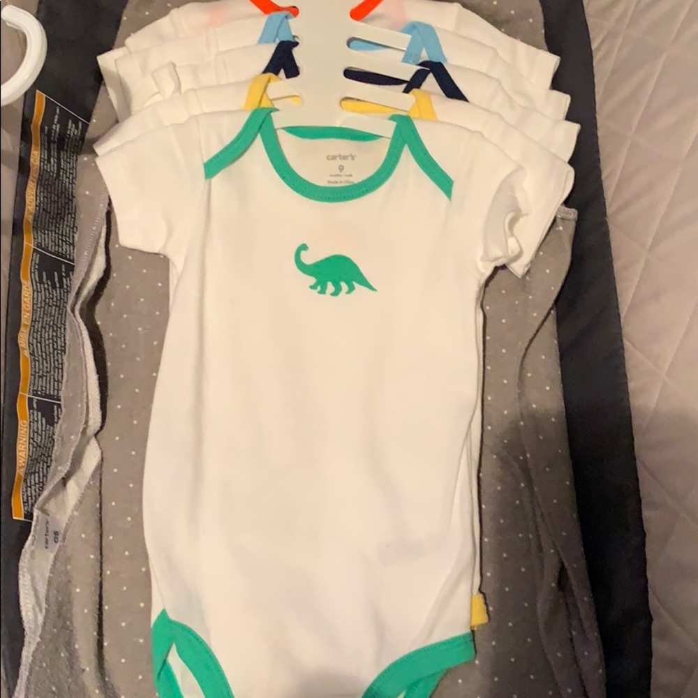 5 pack of dinosaur bodysuits with tags